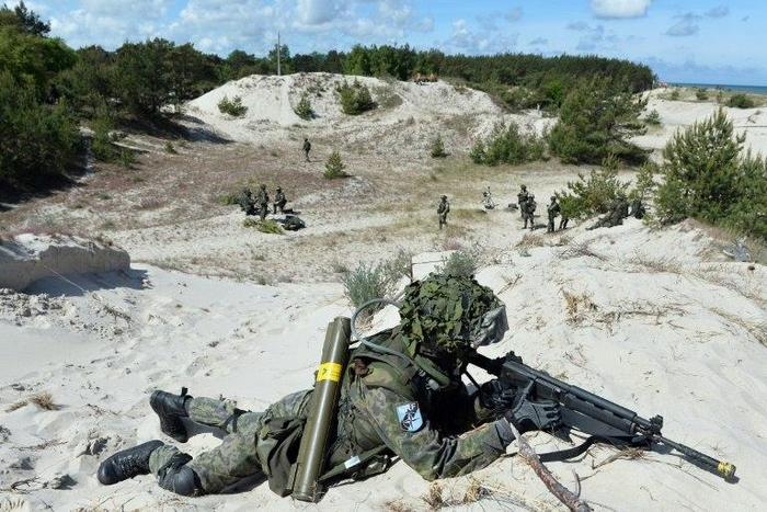 A soldier takes part in NATO military exercises off the coast of Ustka, northern Poland