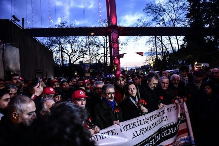 Turkish union members hold a banner that reads, "We will not get used to Terrorism" as they gather in front of the Reina nightclub on January 3, 2017 in Istanbul days after a gunman killed 39 people during New Year celebrations