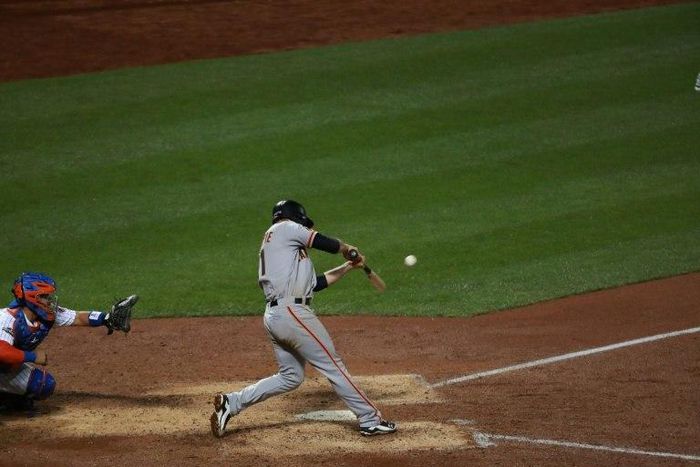 Conor Gillaspie of the San Francisco Giants hits a three-run home run in the ninth inning against the New York Mets on October 5, 2016