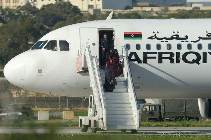 A group of hostages is released from a hijacked Afriqiyah Airways plane in Malta on December 23, 2016