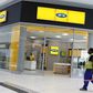 A worker walks past an outlet of South Africa's MTN Group in Johannesburg, South Africa, February 23, 2016.