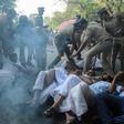 Protests broke out after police escorted two women into a flashpoint temple in the southern Indian state of Kerala on Wednesday