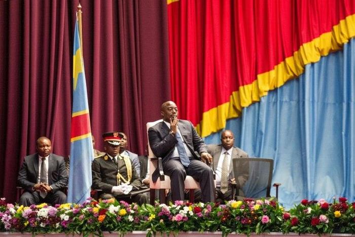 Congolese President Joseph Kabila (C), seen in November 2016, will stay on until the "end of 2017," under the terms of a new political deal between the government and opposition parties