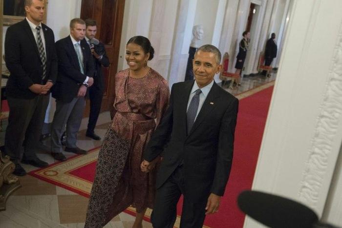 US President Barack Obama and First Lady Michelle Obama arrive to present the Presidential Medal of Freedom, the nation's highest civilian honor, during a ceremony in the East Room of the White House in Washington, DC, November 22, 2016