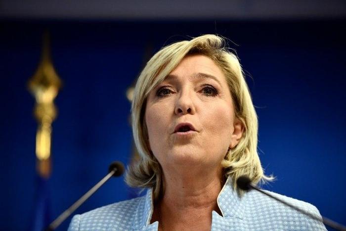 President of the French far-right Front National party and candidate for the 2017 presidential elections Marine Le Pen delivers a speech during a press conference on November 9, 2016 in the party headquarters in Nanterre, near Paris