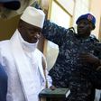 Gambia's President Yahya Jammeh (centre) leaves a polling booth in Banjul on December 1, 2016