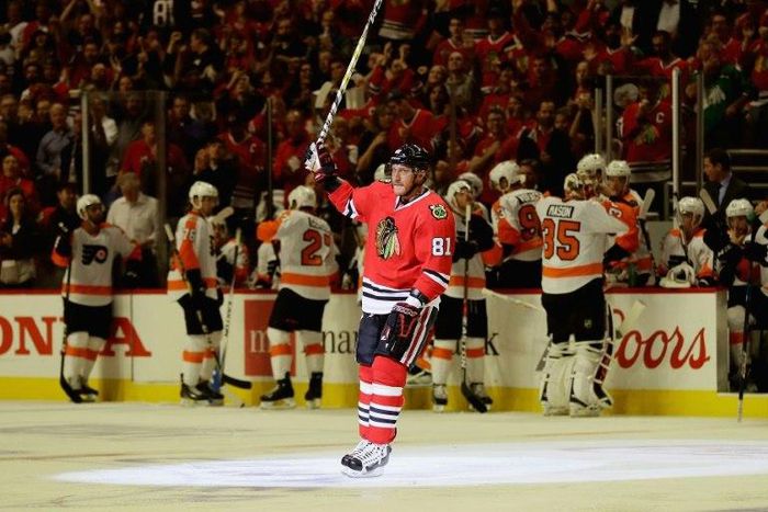 Marian Hossa of the Chicago Blackhawks acknowleges the crowd after scoring his 500th career goal in the second period against the Philadelphia Flyers