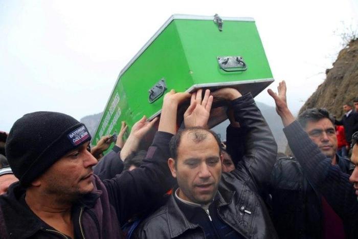 Relatives carry a coffin in Adana, Turkey, on December 1, 2016 during a funeral for the victims of a fire that killed 11 schoolgirls and an adult tutor