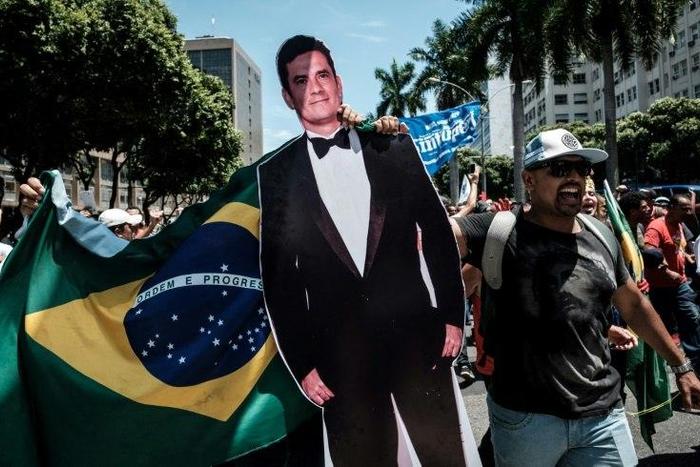 A protester carries a life-size image of Brazilian Federal Judge Sergio Moro, who conducts the Lava Jato probe, the biggest corruption investigation in the nation's history, during a public servants' demo in Rio de Janeiro, on December 12, 2016