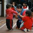 Noelia Garella (C) is the first person with Down syndrome to work as a preschool teacher in Argentina -- and one of the few in the world