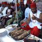 Chidoka cutting the yam