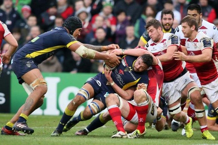 Clermont's Damien Chouly (C) is tackled during their match against Ulster at Kingspan Stadium in Belfast, Northern Ireland on December 10, 2016