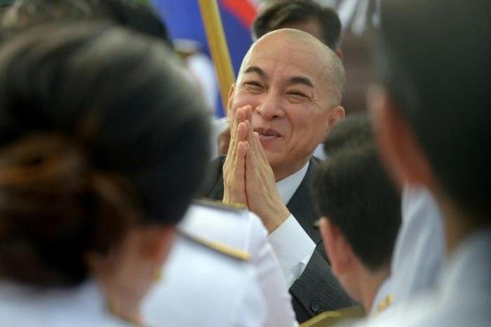 King Norodom Sihamoni (C) is largely respected in Cambodia, where he is seen as above the political fray