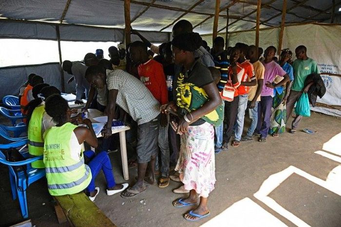 Newly arrived refugees from South Sudan queue to be registered at Kuluba Reception Centre, north of the Ugandan capital Kampala
