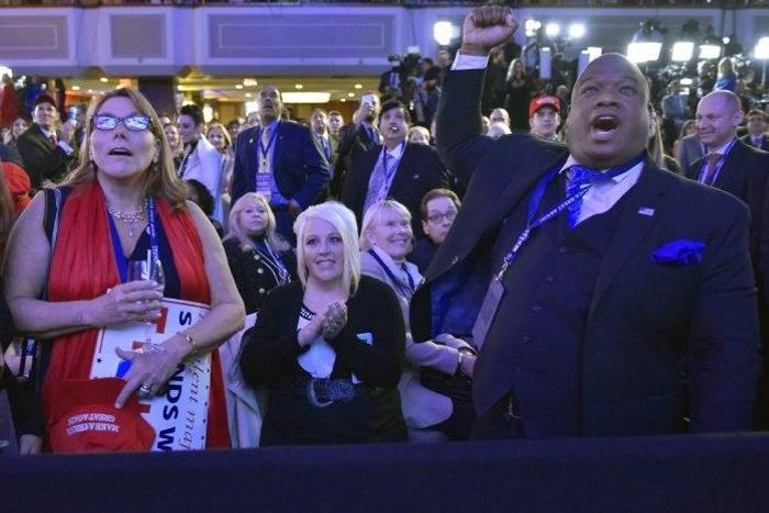 Supporters of Republican presidential nominee Donald Trump react to early results during election night at the New York Hilton Midtown in New York