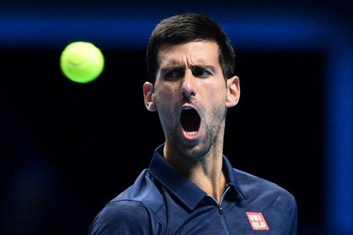 Serbia's Novak Djokovic reacts against Japan's Kei Nishikori during their men's semi-final singles match on day seven of the ATP World Tour Finals tennis tournament in London on November 19, 2016