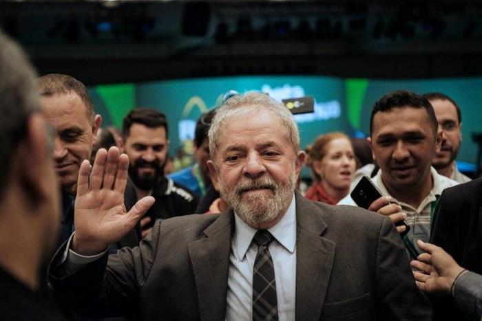 Brazil's former president (2003-2011) Luiz Inacio Lula da Silva waves during the second congress of the IndustriALL Global Union in Rio de Janeiro, Brazil