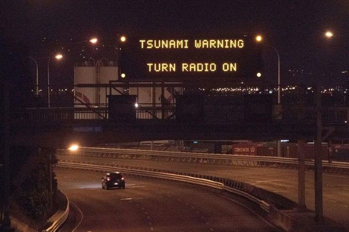 A tsunami warning alert above a highway in Wellington early on November 14, 2016 following an earthquake