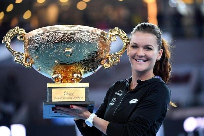 The third-ranked Pole, who cruised through the tournament without dropping a set, sealed her second title in Beijing with an ace for a 6-4, 6-2 win