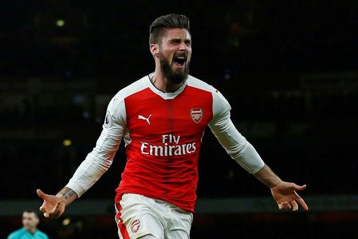 Arsenal striker Olivier Giroud celebrates after scoring the opening goal of the English Premier League football match between Arsenal and West Bromwich Albion at the Emirates Stadium in London on December 26, 2016