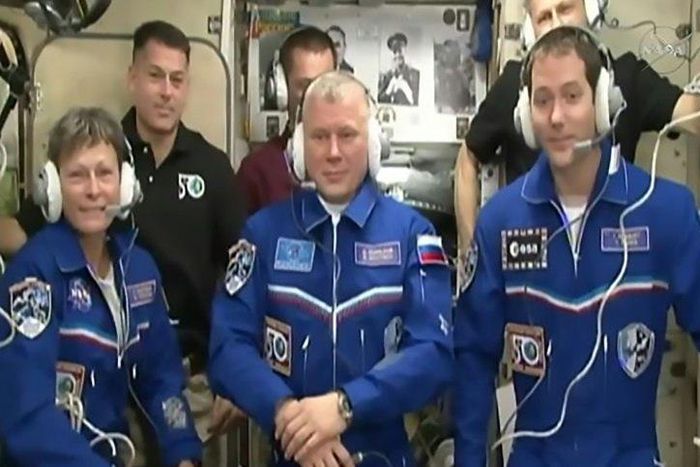 NASA astronaut Peggy Whitson (L), Russian cosmonaut Oleg Novitskiy (C) and Thomas Pesquet (R) of the ESA after docking at the ISS