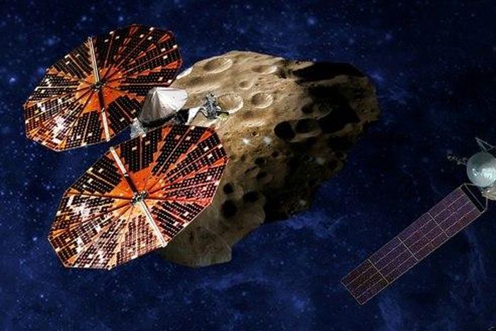 NASA artist drawing of the Lucy spacecraft (L) which will study Jupiter's so-called Trojan asteroids, thought to be relics of a much earlier era in the solar system