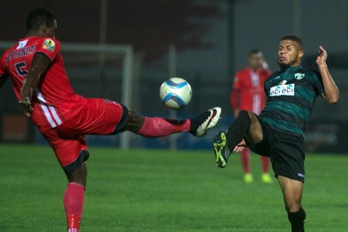 FUS Rabat's Ass Madaw Sy (left) and Mouloudia Bejaia's Morgan Betorangal in action during the CAF Confederation Cup semi-final in Rabat, on September 25, 2016