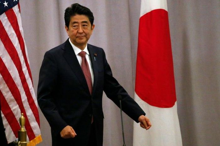 Japanese Prime Minister Shinzo Abe said he held "candid" talks with US president-elect Donald Trump in "a very warm atmosphere"