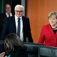 German Chancellor Angela Merkel and Foreign Minister Frank-Walter Steinmeier arrive for the weekly cabinet meeting in Berlin on November 9, 2016