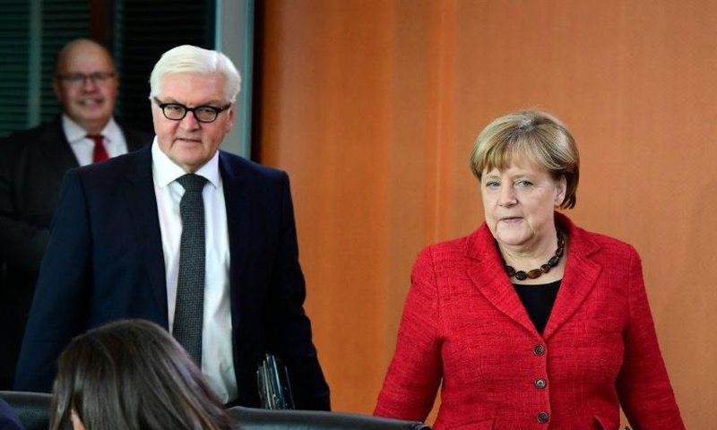 German Chancellor Angela Merkel and Foreign Minister Frank-Walter Steinmeier arrive for the weekly cabinet meeting in Berlin on November 9, 2016