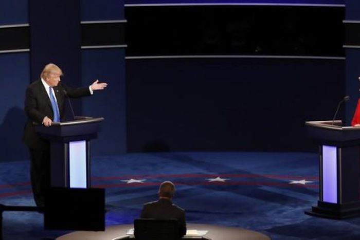 Republican U.S. presidential nominee Donald Trump speaks as Democratic U.S. presidential nominee Hillary Clinton listens during their first presidential debate at Hofstra University in Hempstead, New York, U.S., September 26, 2016.
