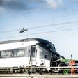 Investigators said the passenger train appeared to have struck an empty truck trailer that had blown off a cargo train
