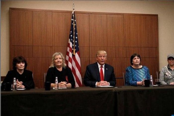 Republican presidential nominee Donald Trump sits with (from R-L) Paula Jones, Kathy Shelton, Juanita Broaddrick, Kathleen Willey in a hotel conference room in St. Louis, Missouri, U.S., shortly before the second presidential debate at Washington Unive...