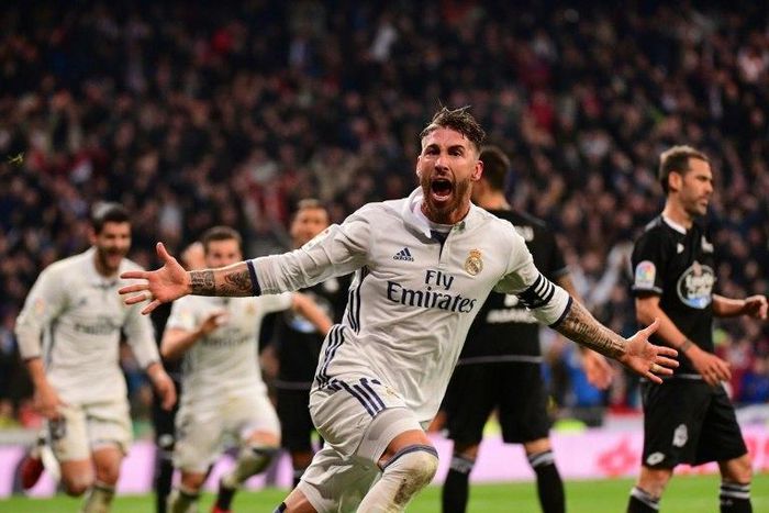 Real Madrid's defender Sergio Ramos celebrates after scoring against Deportivo at the Santiago Bernabeu stadium in Madrid on December 10, 2016
