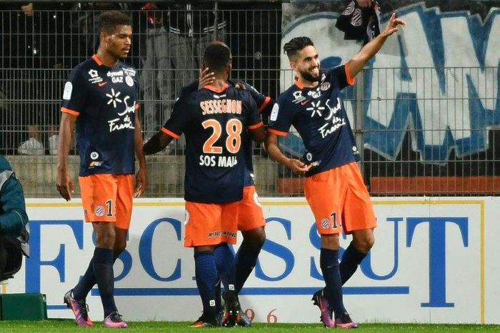 Montpellier's French midfielder Ryad Boudebouz (R) celebrates after scoring a goal during the French L1 football match between Montpellier and Marseille at the La Mosson Stadium in Montpellier, southern France, on November 4, 2016