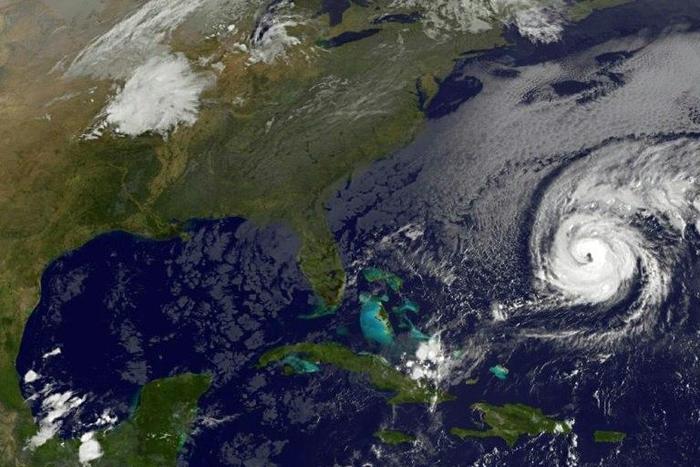 This NOAA-NASA Goes East project satellite image shows Hurricane Nicole (R) in the western Atlantic at 1137UTC on October 12, 2016