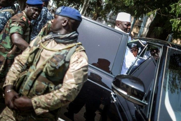 Incumbent Gambian president Yahya Jammeh gets back into his armoured car after casting his marble at a polling station in Banjul on December 1, 2016