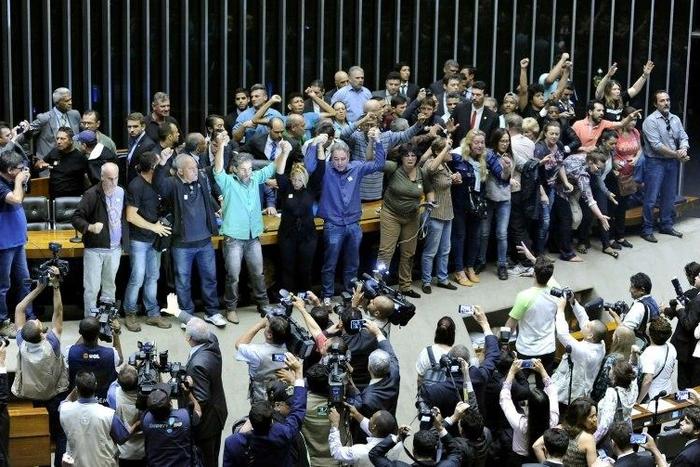 Demonstrators in favor of a military intervention in Brazil invade the legislative chamber on November 16, 2016
