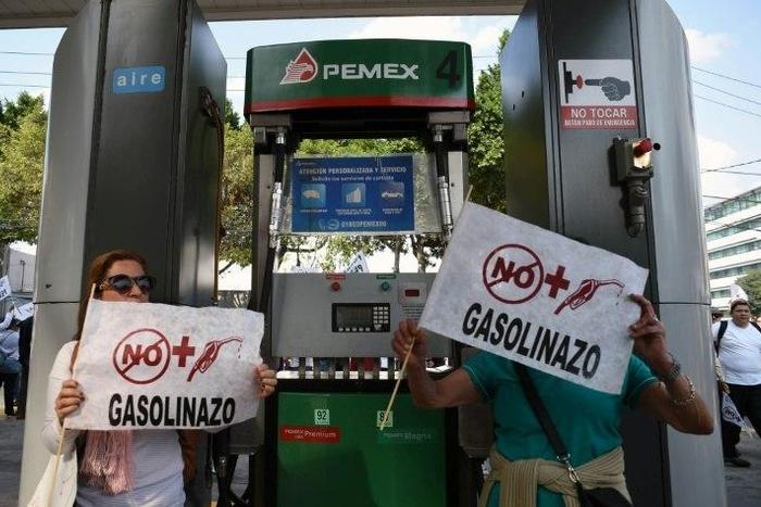 Demonstrators at a petrol station protest the rise in fuel prices in Mexico City on January 1, 2017