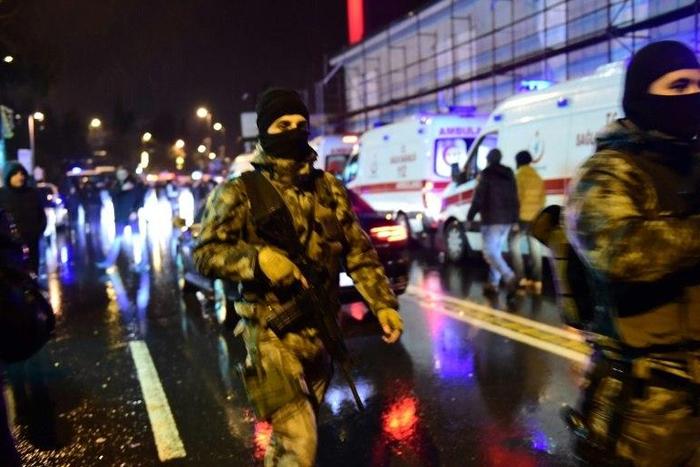 Turkish special force police officers and ambulances are seen at the site of an armed attack at the Reina nightclub in Istanbul on January 1, 2017