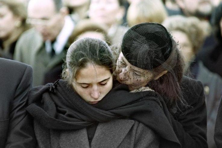 Mazarine Pingeot -- the daughter of former French president Francois Mitterrand -- is comforted by her mother Anne Pingeot, during her father's 1996 funeral in Jarnac