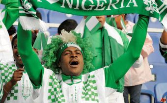 An illustrative photo of a Nigerian football fan cheering the Super Eagles