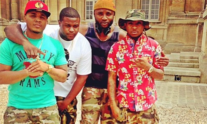 HKN Gang (Sina Rambo, Adewale Adeleke, Kamal (Davido's manager), Davido) all wearing camo shorts