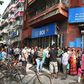 People queue outside a bank in Kolkata to deposit and exchange 500 and 1000 currency notes after the government's shock decision to withdraw them from circulation