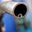 A motorist holds a fuel pump at a Gulf petrol station in London,  file. REUTERS/Luke MacGregor/File Photo