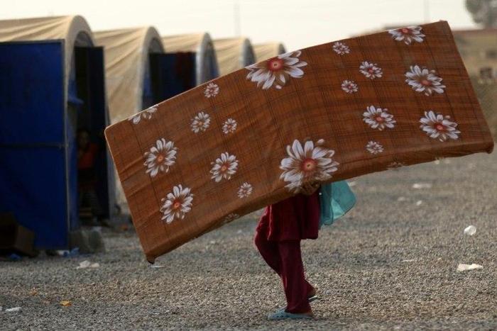A displaced Iraqi who fled the violence in Mosul, at al-Khazar camp on October 27, 2016