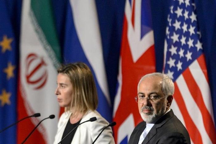 Iranian Foreign Minister Mohammad Javad Zarif (R) addressed a letter to EU's foreign policy chief Federica Mogherini (L) calling for a meeting of the commission