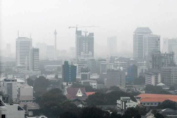 Haze caused by vehicle emissions hangs over Jakarta's skyline