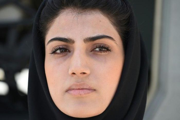 In a picture taken on April 26, 2015, Afghanistan's first female pilot, Niloofar Rahmani, poses for a photograph at an Air Force airfield in Kabul