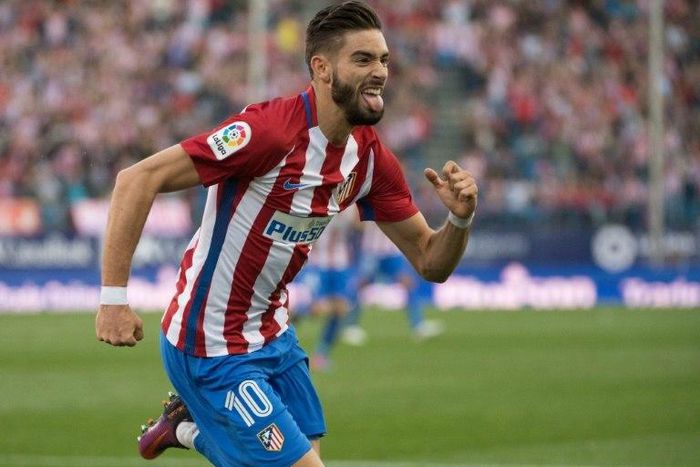 Atletico Madrid's Belgian midfielder Yannick Ferreira Carrasco celebrates a goal during the Spanish league football match between Club Atletico de Madrid and Malaga CF on October 29, 2016